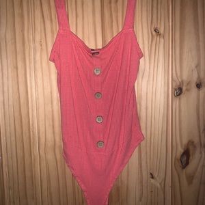 Rouge pink body suit.